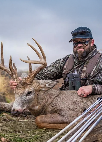 man holding dead deer at h5 ranch in colorado